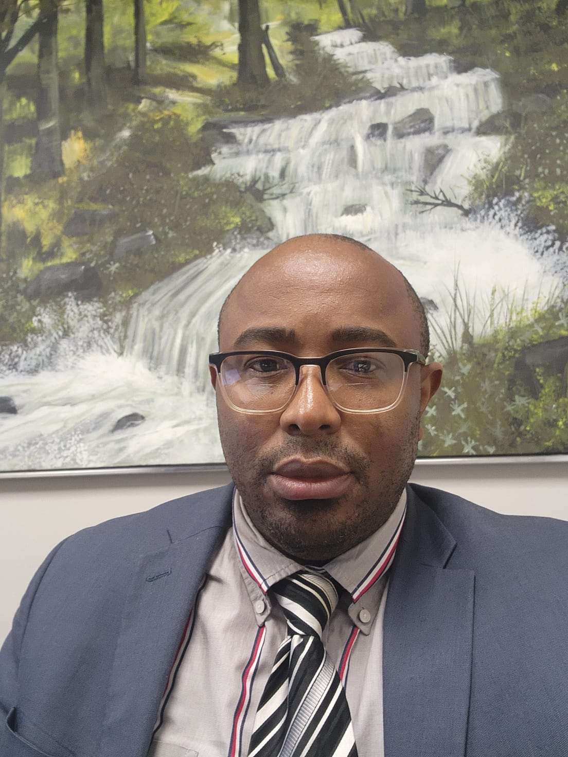 Portrait of the founding engineer in a corporate setting